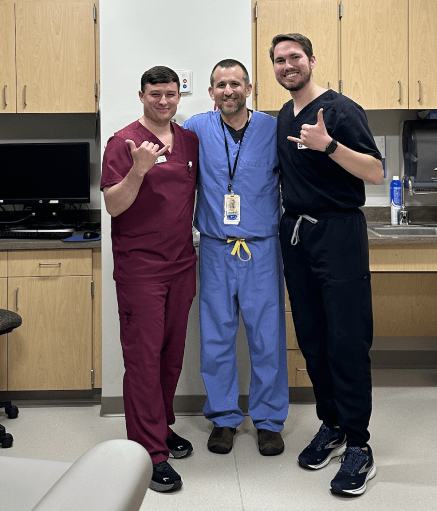 Two students with an attending on a clinical rotation - Navigating Clinical Rotations