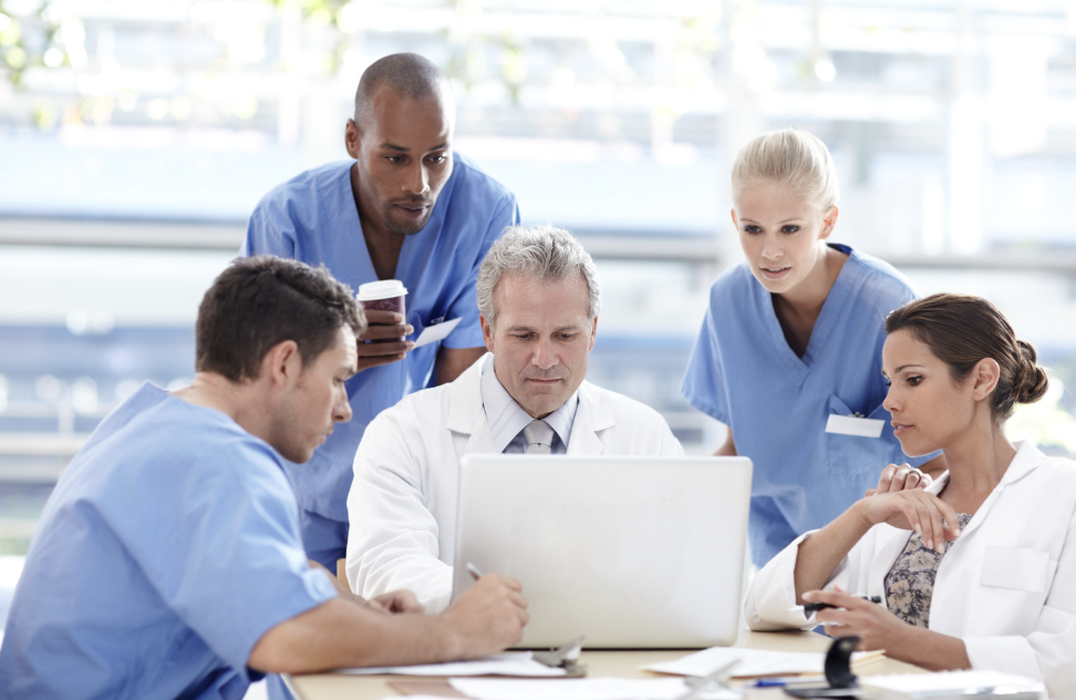 Picture of multiple doctors working together in an interprofessional manner